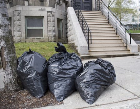 Workers managing construction debris for clearance